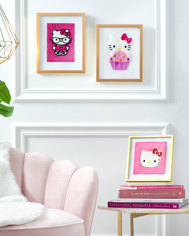 pink and white room with hello kitty framed greeting cards
