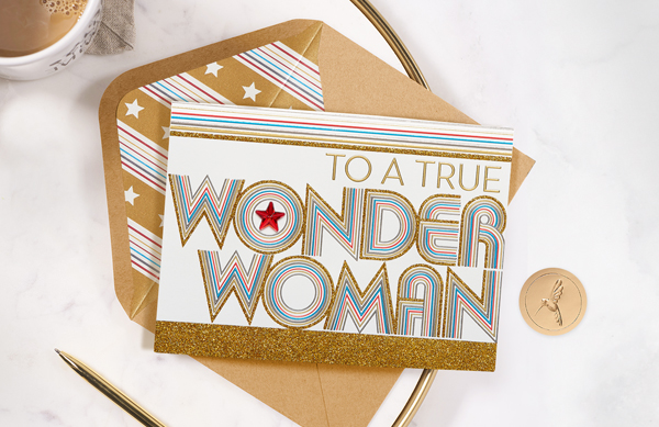 Wonder woman card and gold pen