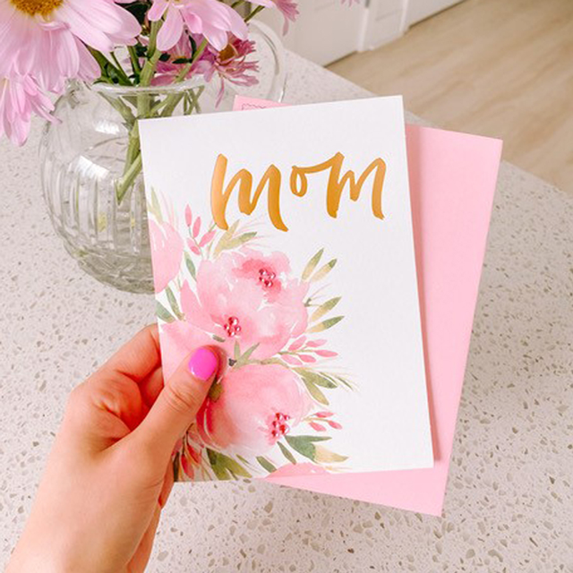 Woman holding Mother's Day card
