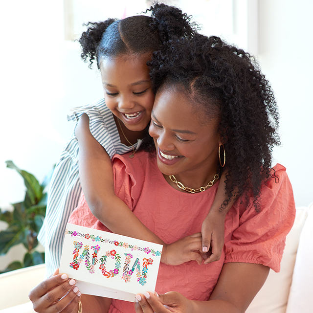 Daughter hugging Mom with Papyrus Mother's Day card