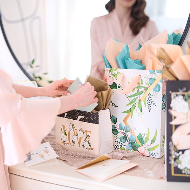 woman opening wedding gifts