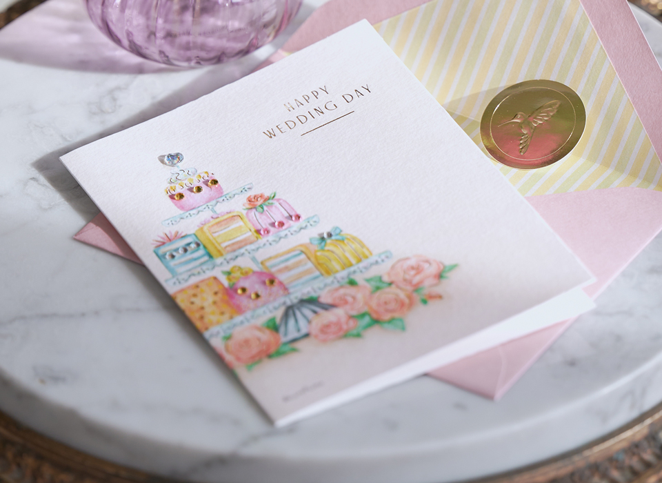 Wedding card on a marble table.