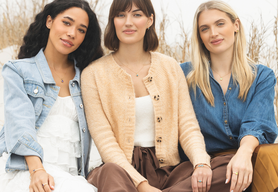 3 Females wearing Papyrus by Reeds Jewelry.