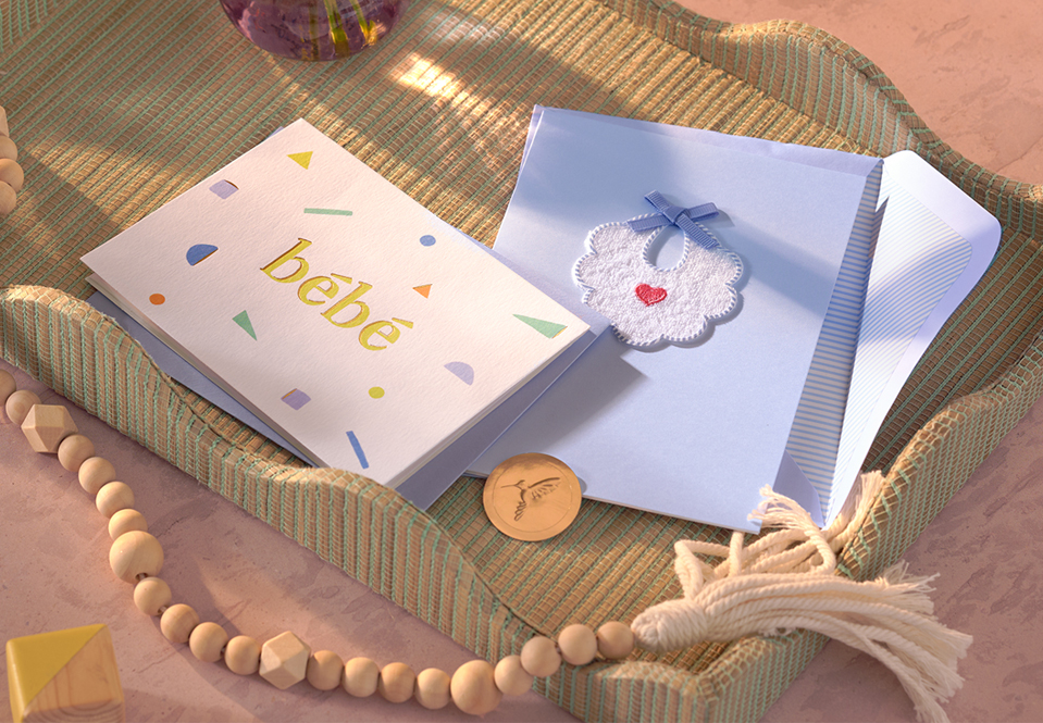New Baby cards on a tray with dramatic lighting