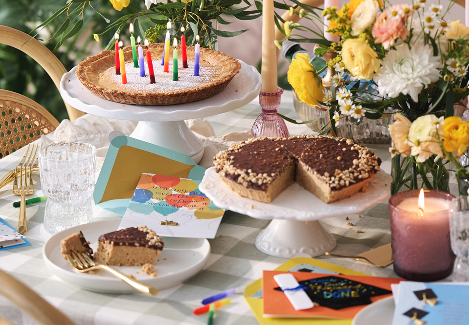 Colorful tall candles on a Milk Bar Pie