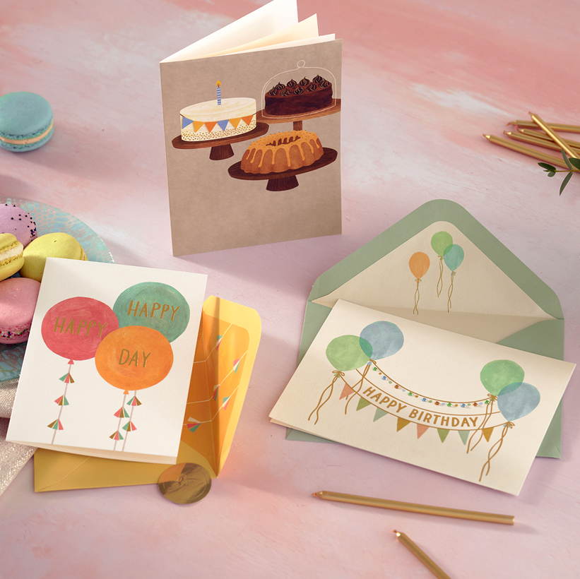 3 birthday cards on a table