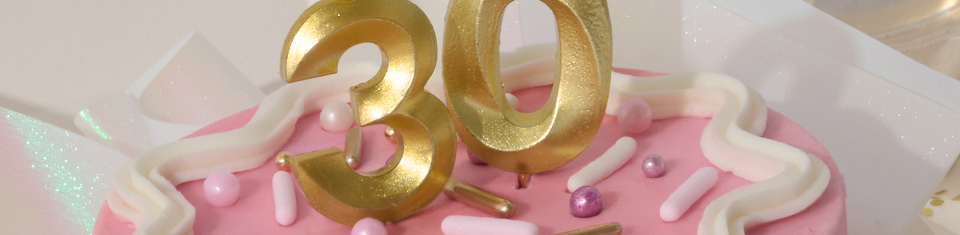 Birthday cake with numbered candles.