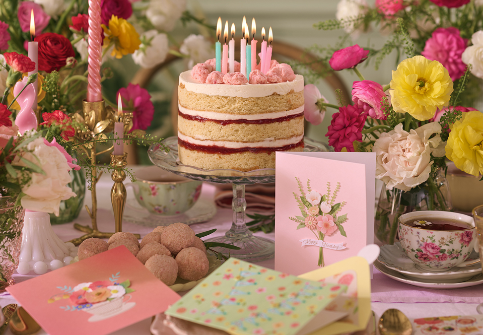 Colorful candles on a Milk Bar Pie with Papyrus cards
