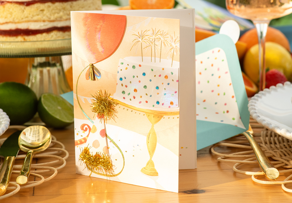 Birthday card with a cake and balloon