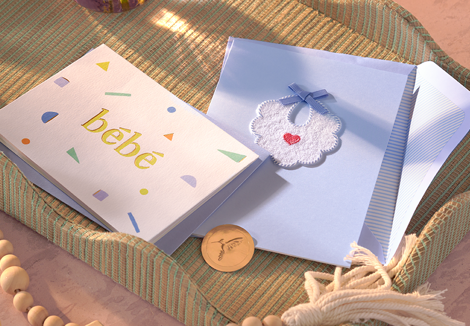 Two baby cards on a tray