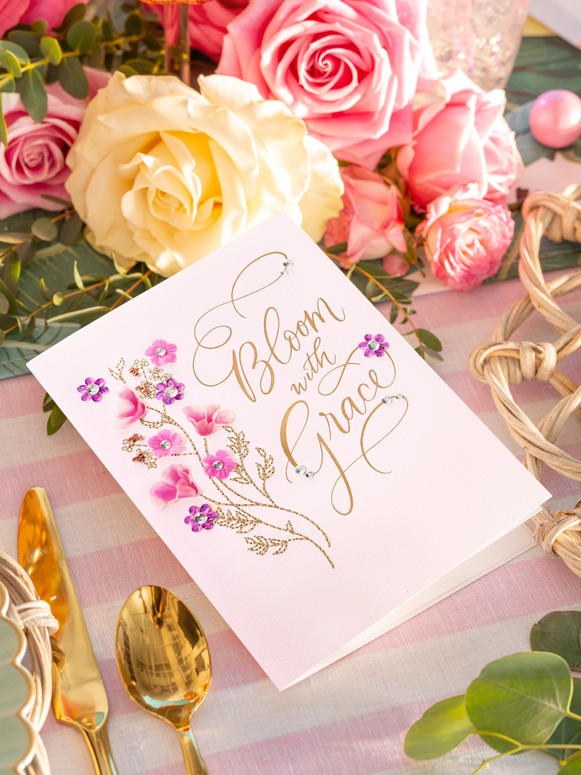 Papyrus Floral Blank Greeting Card on floral place setting. 