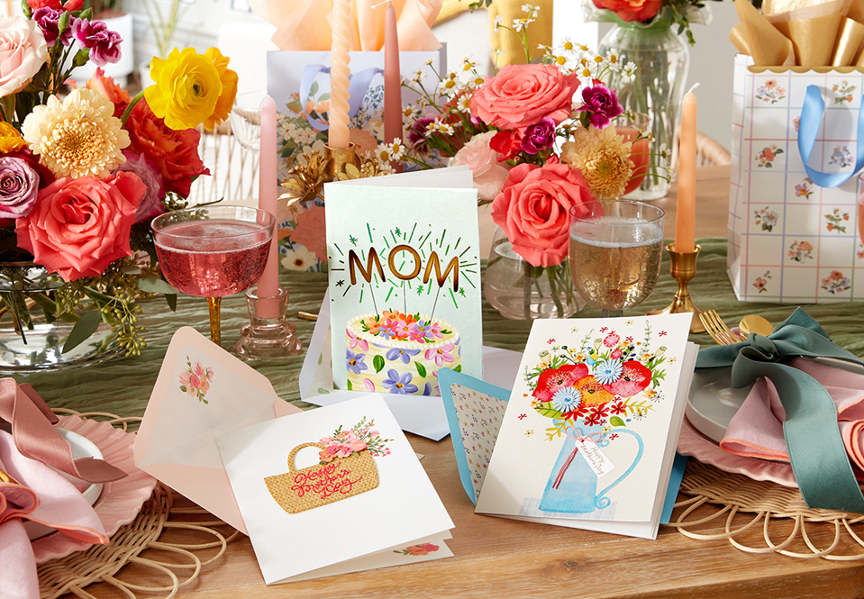 Table with flowers, drinks and Mother's Day cards