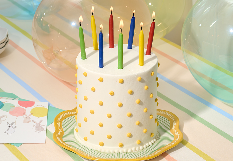 Birthday candles on a polka dot cake