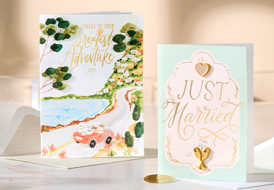 Beautiful wedding cards on an elegant marble table