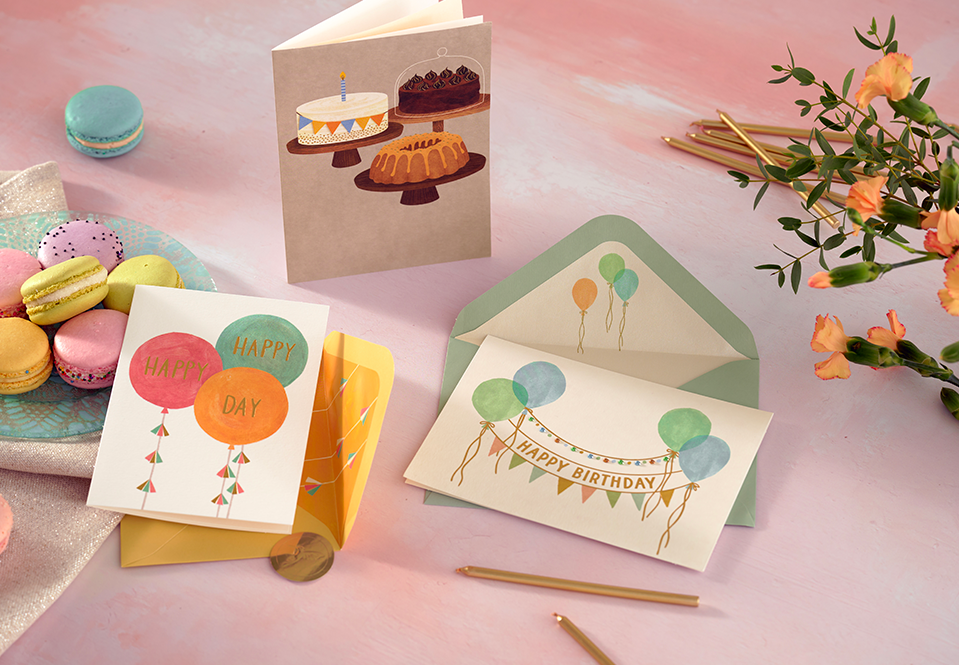 Three Birthday cards on a table